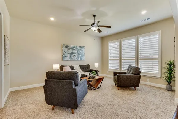 a living room with furniture and a window