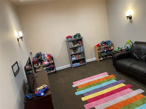 a living room with toys and a couch