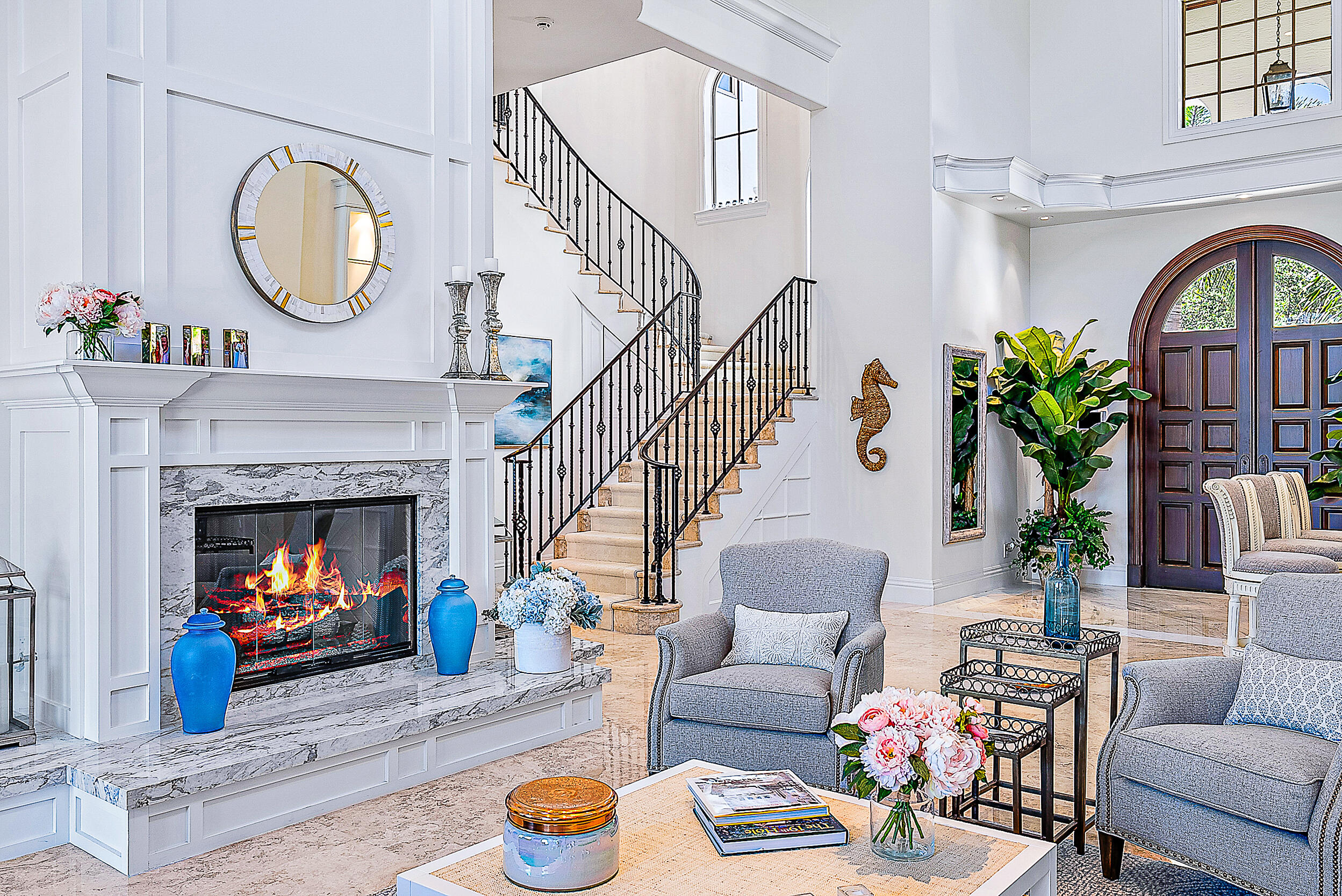 337 Old Jupiter Beach Road Jupiter, FL 33477 - Photo 17 of 38 a living room with furniture a fireplace and a potted plant