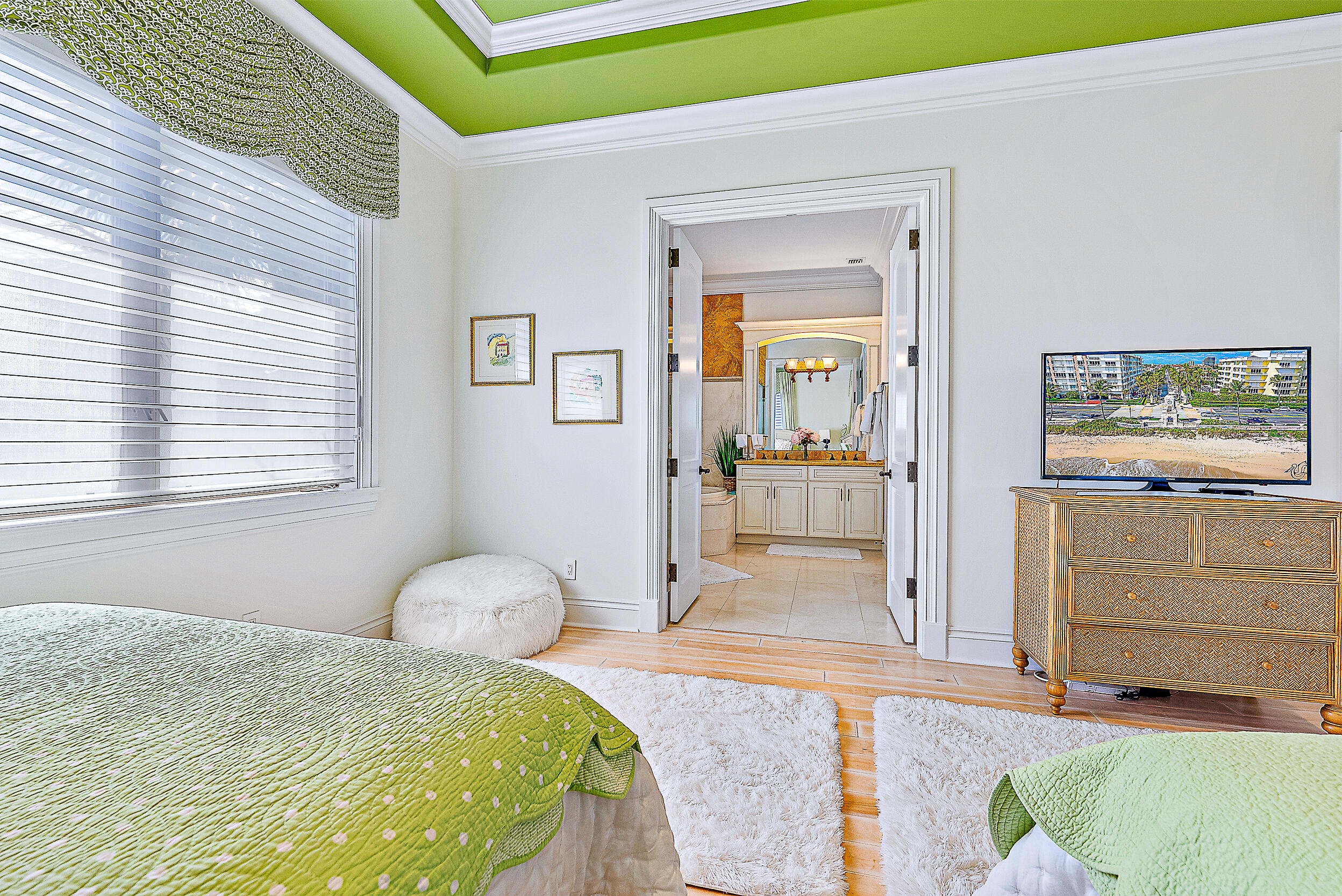 337 Old Jupiter Beach Road Jupiter, FL 33477 - Photo 30 of 38 a bedroom with a bed and a cabinets