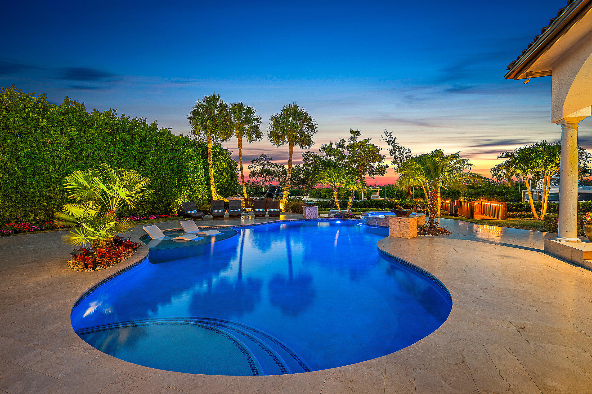 337 Old Jupiter Beach Road Jupiter, FL 33477 - Photo 8 of 38 a view of a swimming pool with an outdoor seating
