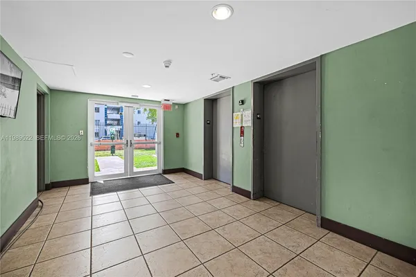 a view of an empty room and window