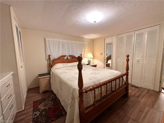 a bed room with a bed and a window