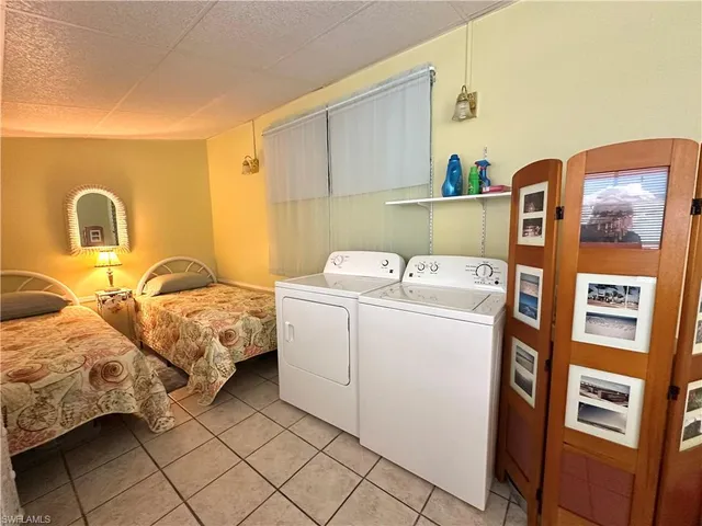 a bed room with a bed and a window