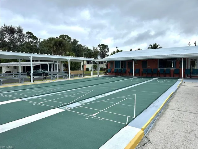 a view of a house with swimming pool and a yard