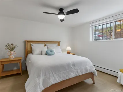 a bedroom with a bed and window