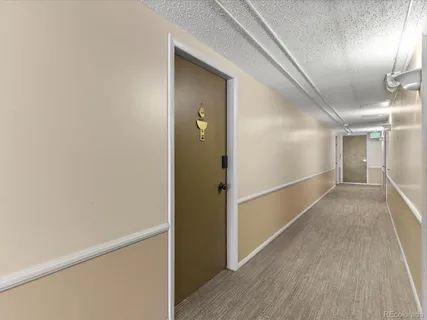 a view of hallway with wooden floor