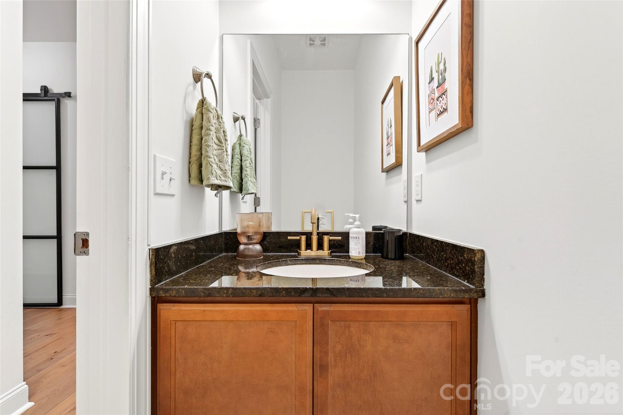 132 Maple Ridge Drive Old Fort, NC 28762 - Photo 22 of 40 a bathroom with a granite countertop sink and a mirror