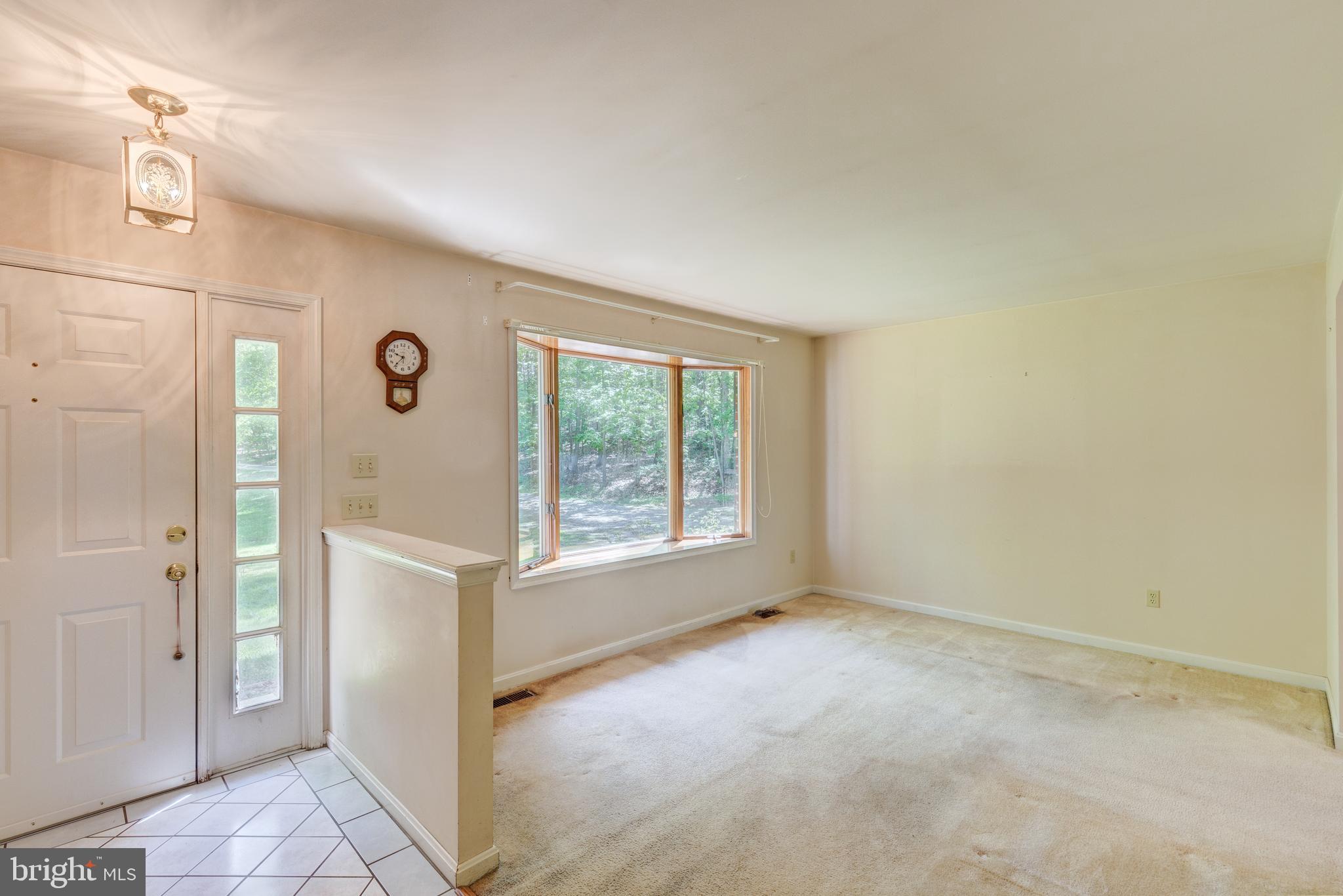 2409 Stone Road Westminster, MD 21158 - Photo 2 of 36 Tiled entry foyer & living room
