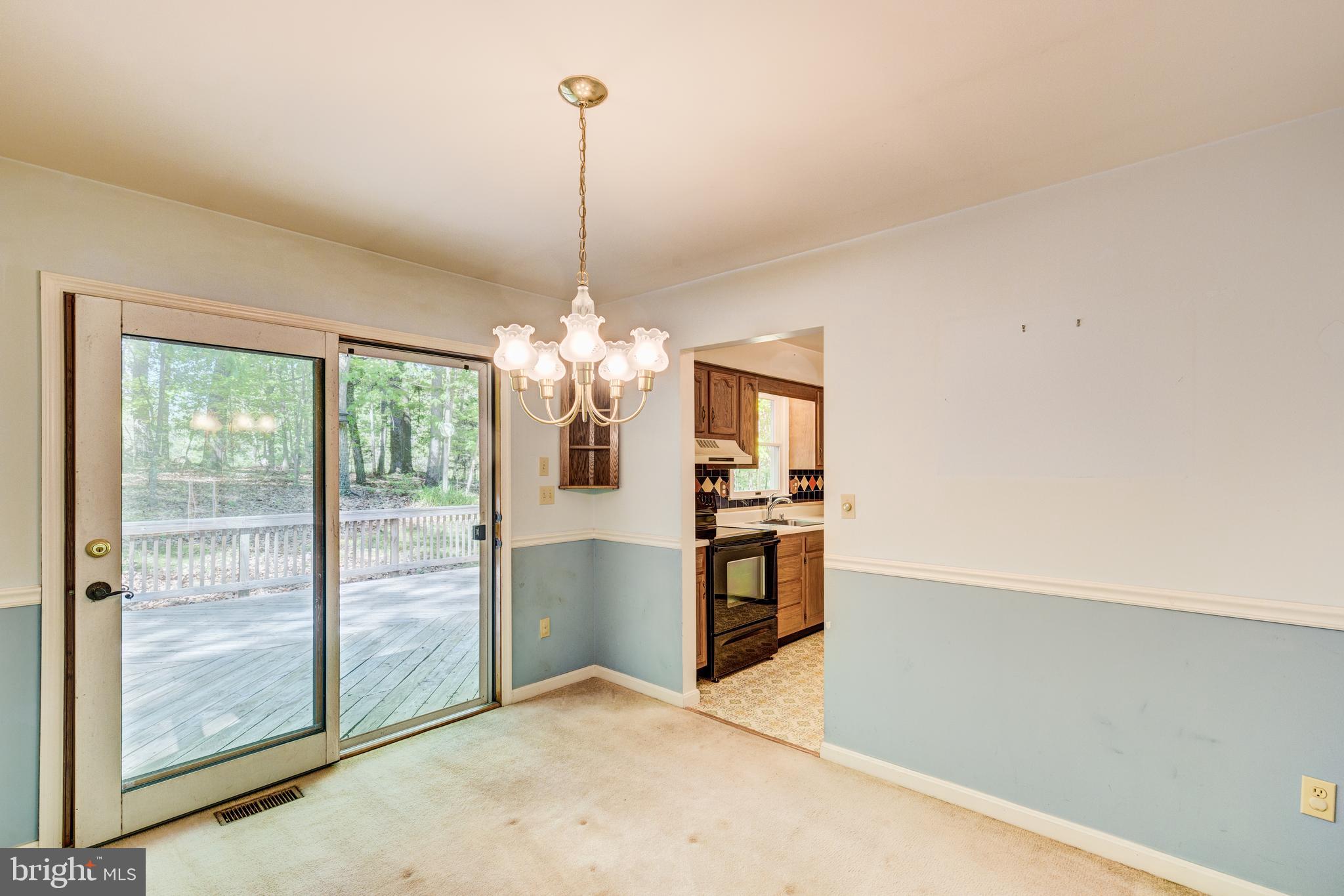 2409 Stone Road Westminster, MD 21158 - Photo 5 of 36 Dining room w/chair rail & access to deck