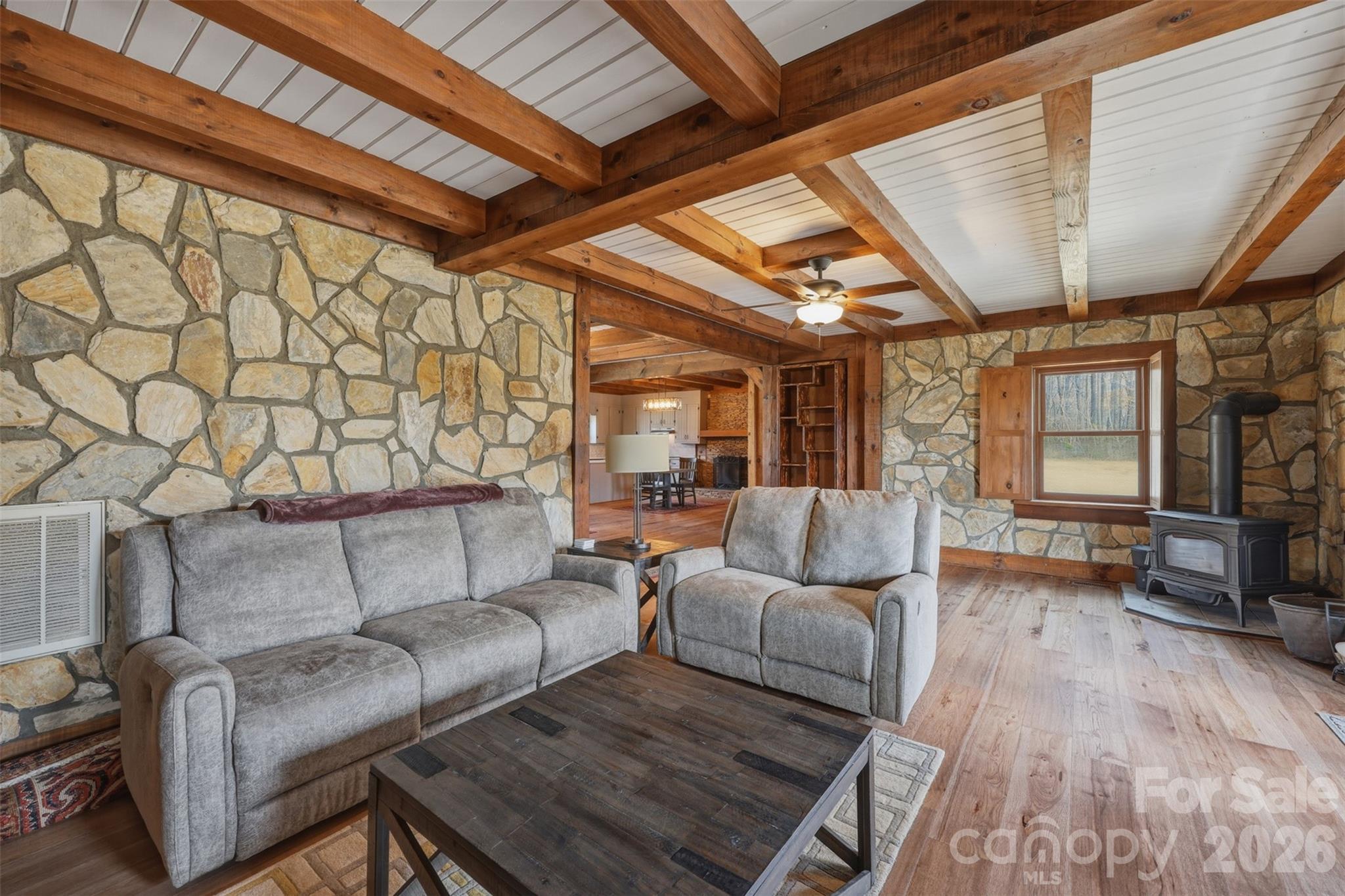 2255 Mt Olive Church Road Newton, NC 28658 - Photo 12 of 43 a living room with furniture and a wooden floor