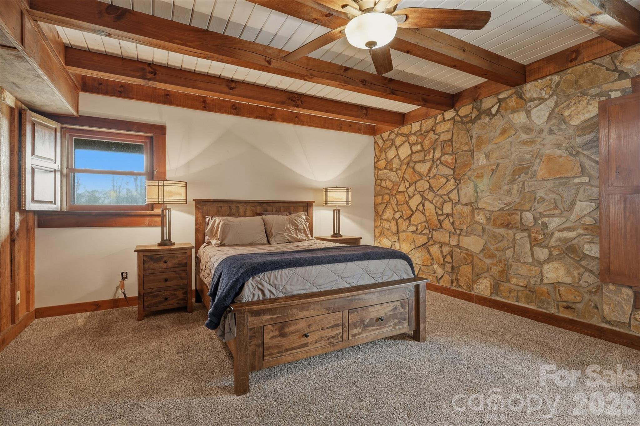 2255 Mt Olive Church Road Newton, NC 28658 - Photo 13 of 43 a bedroom with a bed and a chandelier