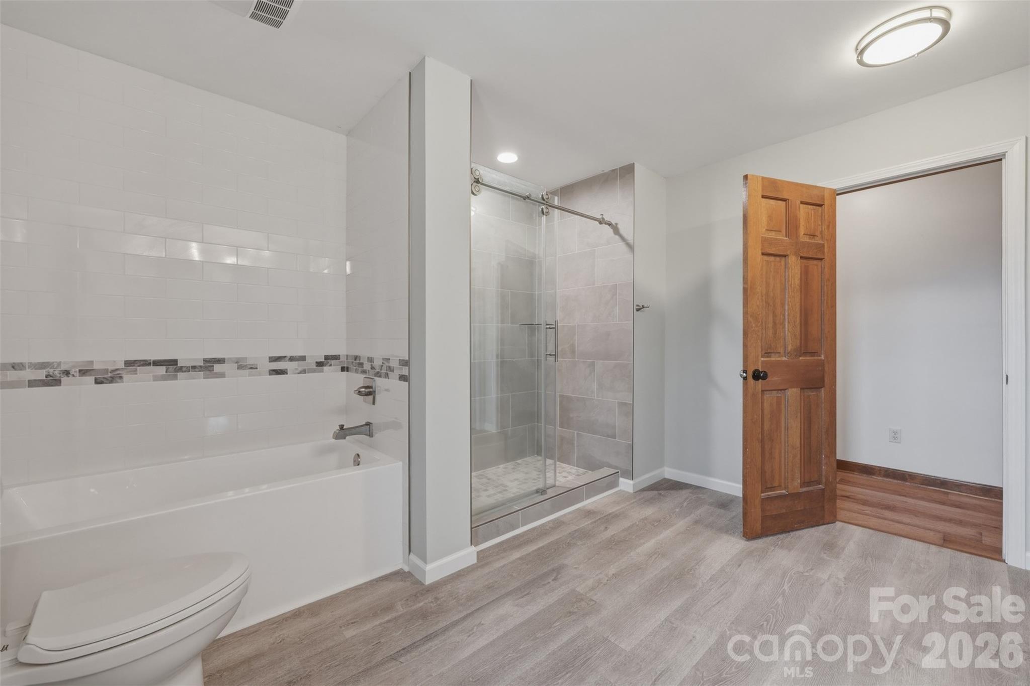 2255 Mt Olive Church Road Newton, NC 28658 - Photo 21 of 43 a bathroom with a shower a toilet and a shower