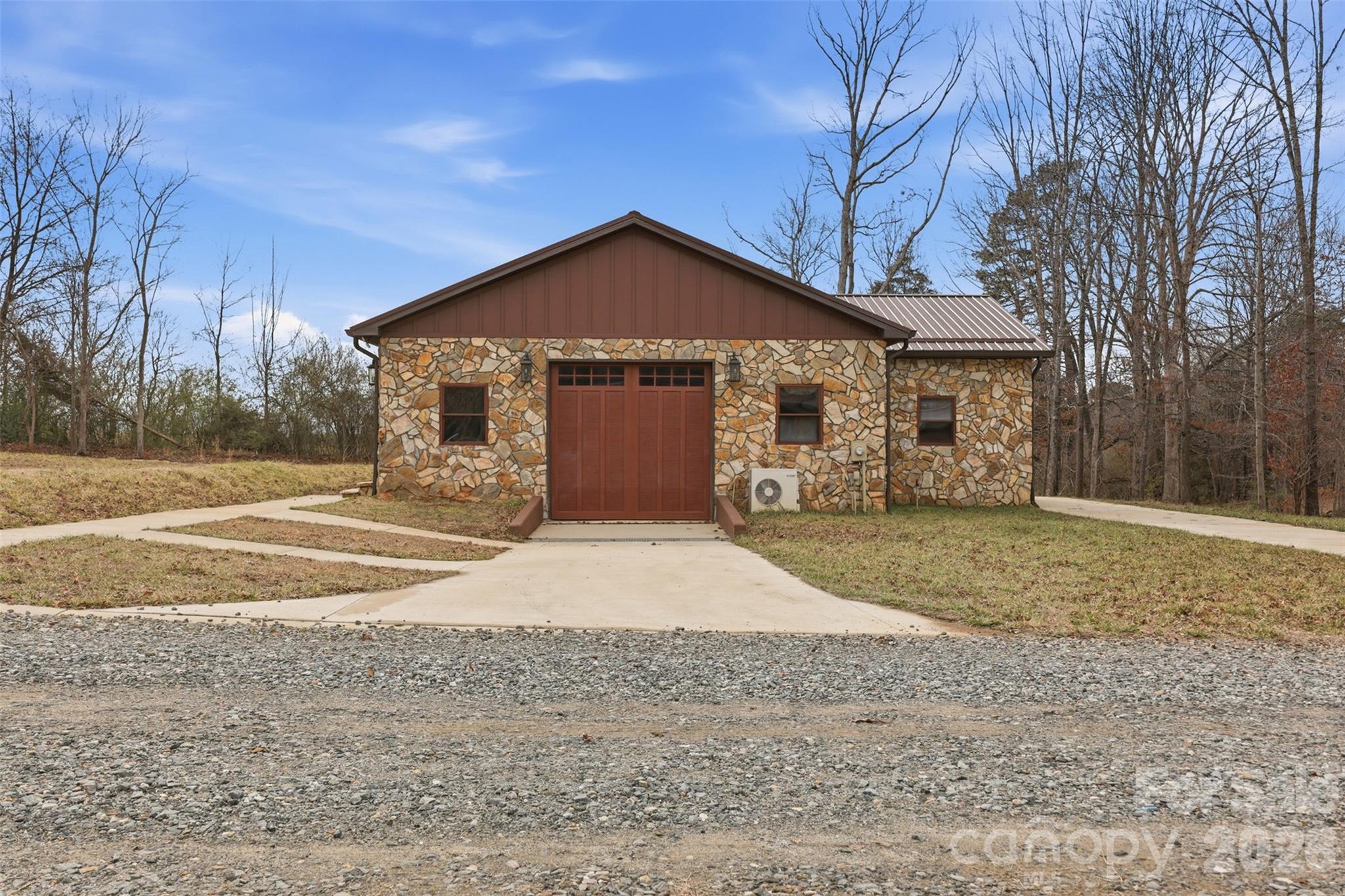 2255 Mt Olive Church Road Newton, NC 28658 - Photo 29 of 43 a front view of a house with a yard and garage