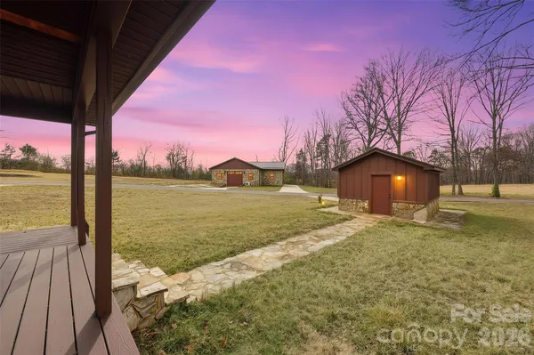 a view of a lake with a house in the background