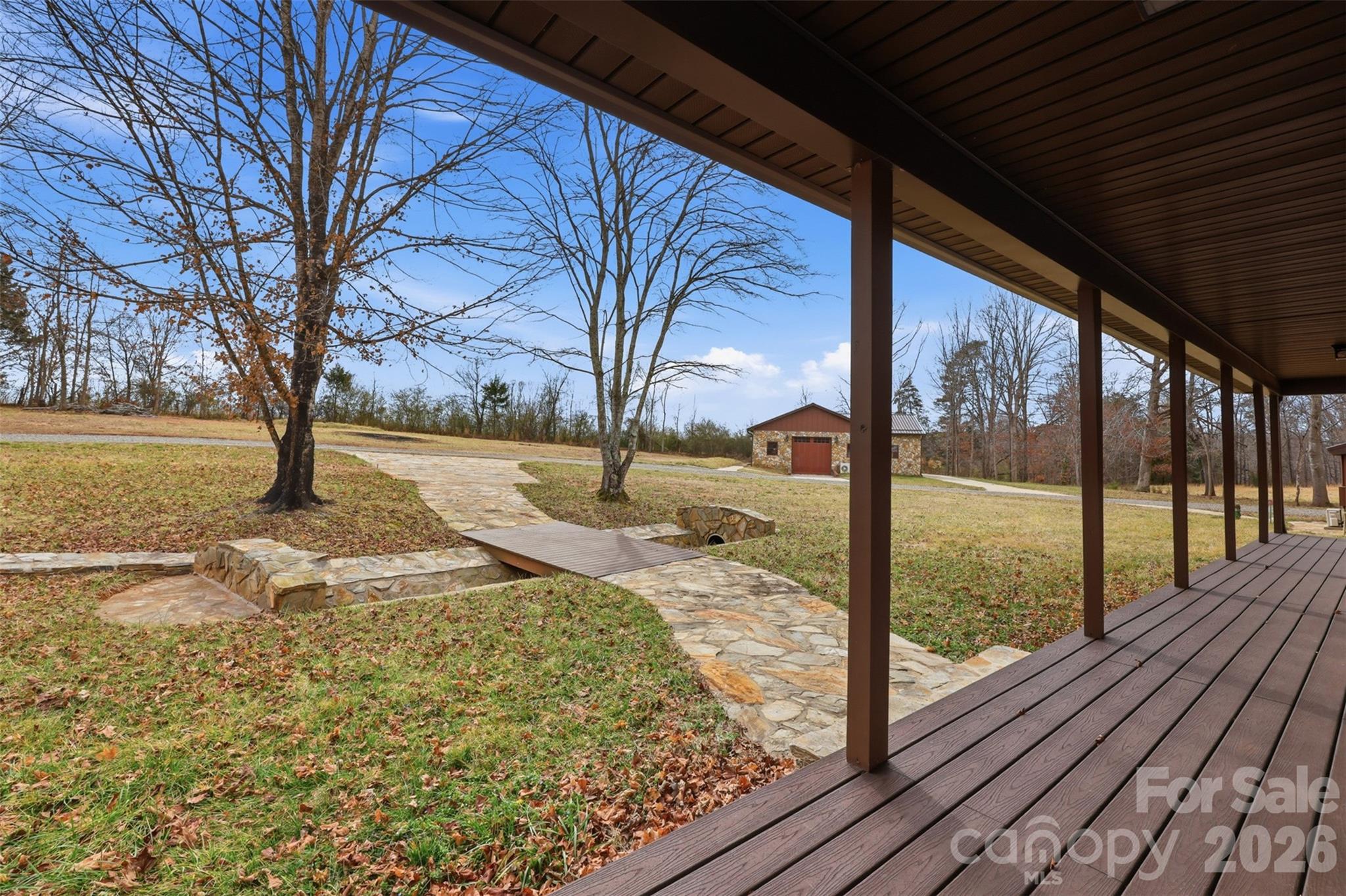 2255 Mt Olive Church Road Newton, NC 28658 - Photo 5 of 43 a view of a yard with wooden floor and floor to ceiling window
