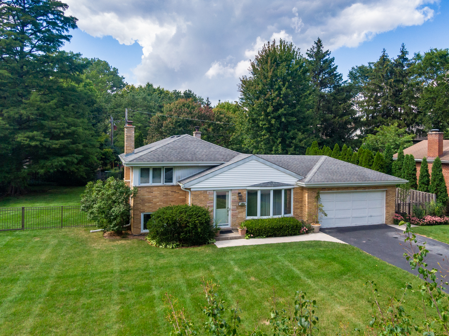 1420 Lee Road Northbrook, IL 60062 - Photo 1 of 36 a view of a house with a big yard plants and large trees