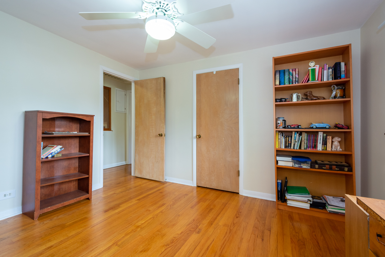 1420 Lee Road Northbrook, IL 60062 - Photo 16 of 36 a view of room with cabinet and a book shelf