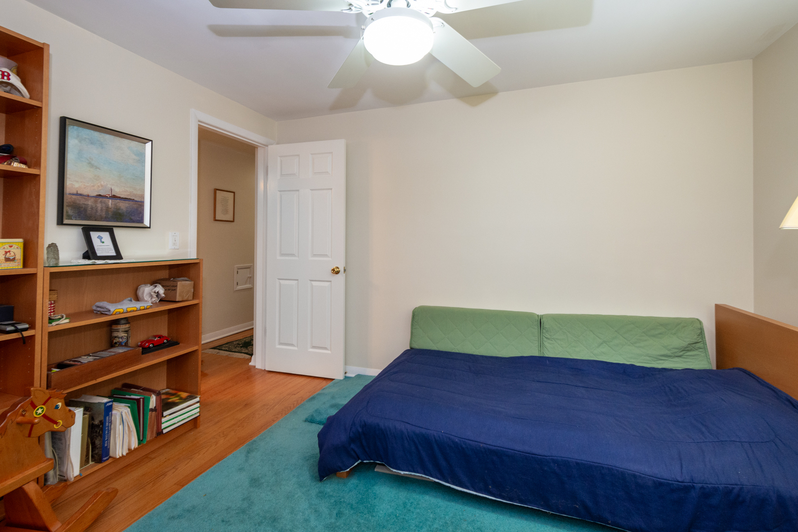 1420 Lee Road Northbrook, IL 60062 - Photo 19 of 36 a living room with a bed furniture and a window