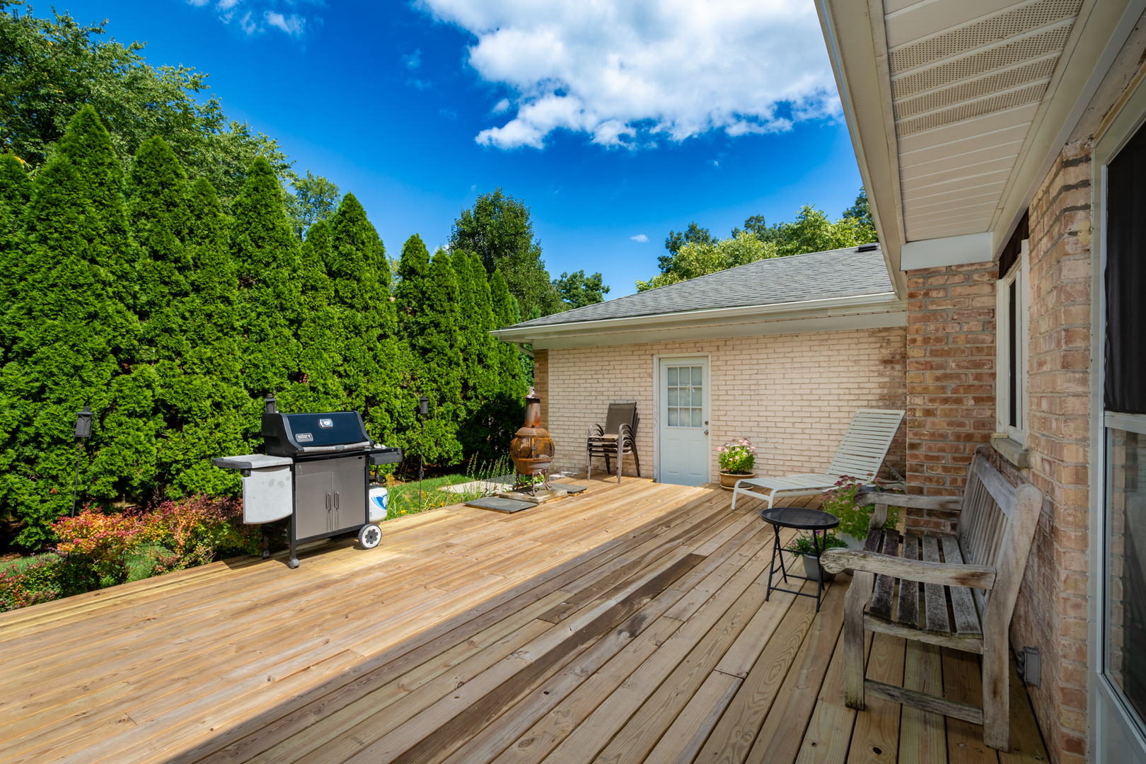 1420 Lee Road Northbrook, IL 60062 - Photo 27 of 36 a backyard of a house with wooden floor yard outdoor seating and yard in backside