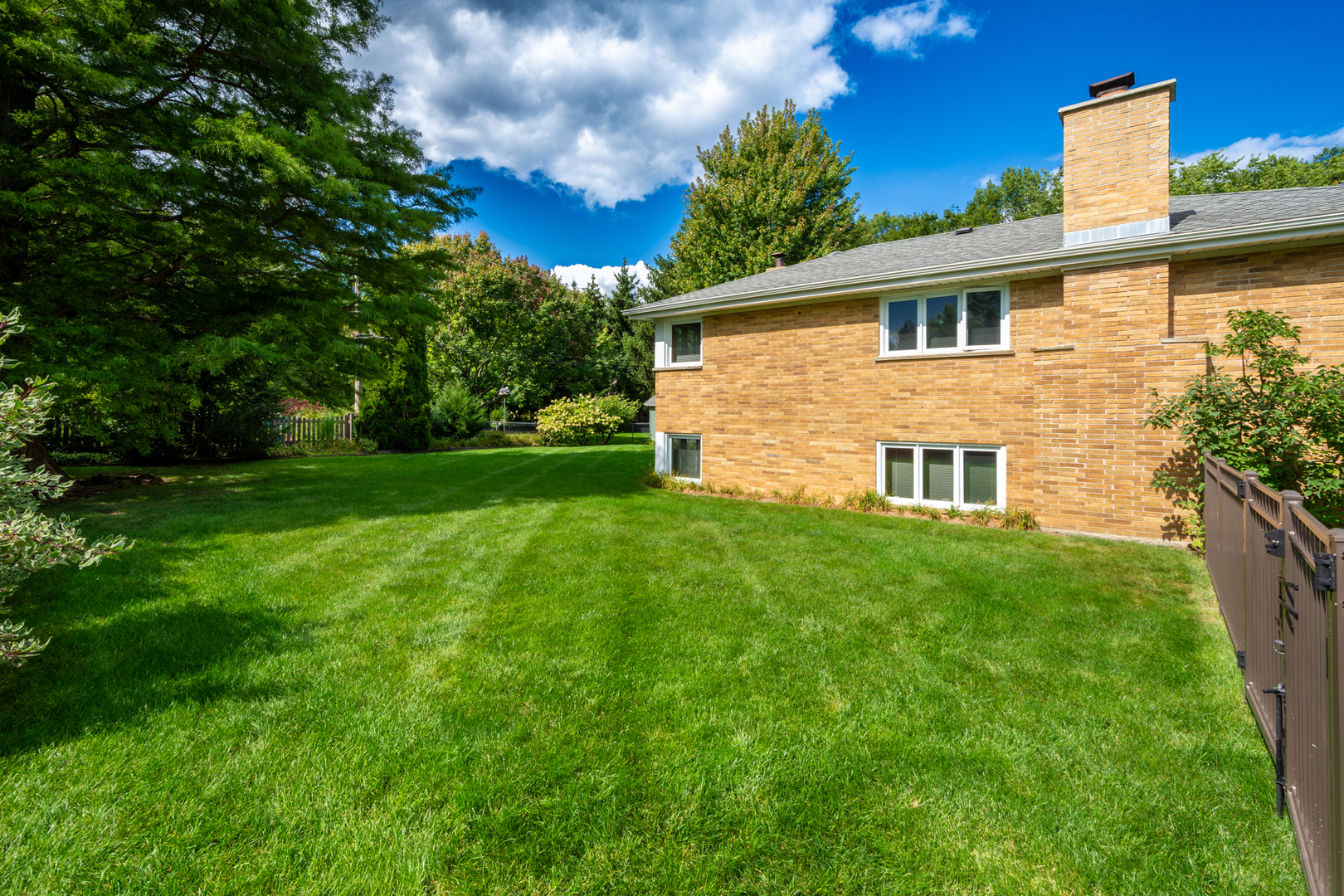 1420 Lee Road Northbrook, IL 60062 - Photo 32 of 36 a view of a backyard with plants and large tree