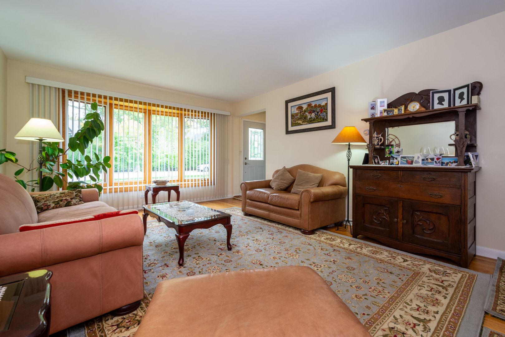 1420 Lee Road Northbrook, IL 60062 - Photo 5 of 36 a living room with furniture a couch and a fireplace