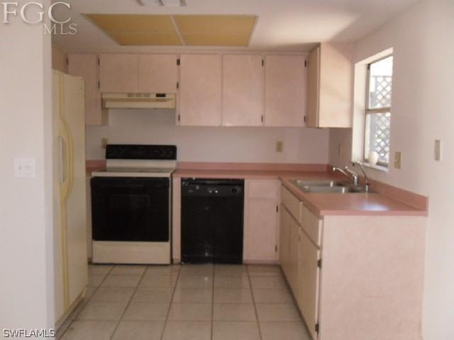 9016 Morris Road Fort Myers, FL 33967 - Photo 3 of 12 a kitchen with a sink and cabinets