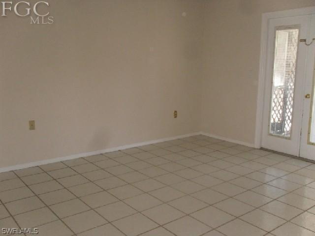 9016 Morris Road Fort Myers, FL 33967 - Photo 5 of 12 an empty room with windows
