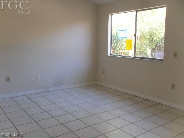 9016 Morris Road Fort Myers, FL 33967 - Photo 7 of 12 an empty room with a window