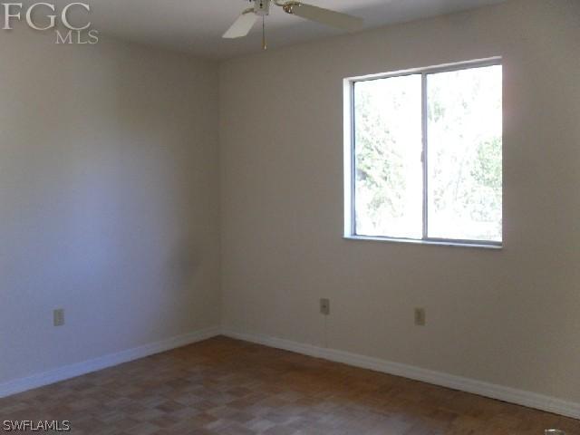 9016 Morris Road Fort Myers, FL 33967 - Photo 9 of 12 an empty room with a window