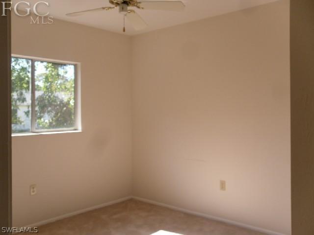 9016 Morris Road Fort Myers, FL 33967 - Photo 10 of 12 an empty room with a window
