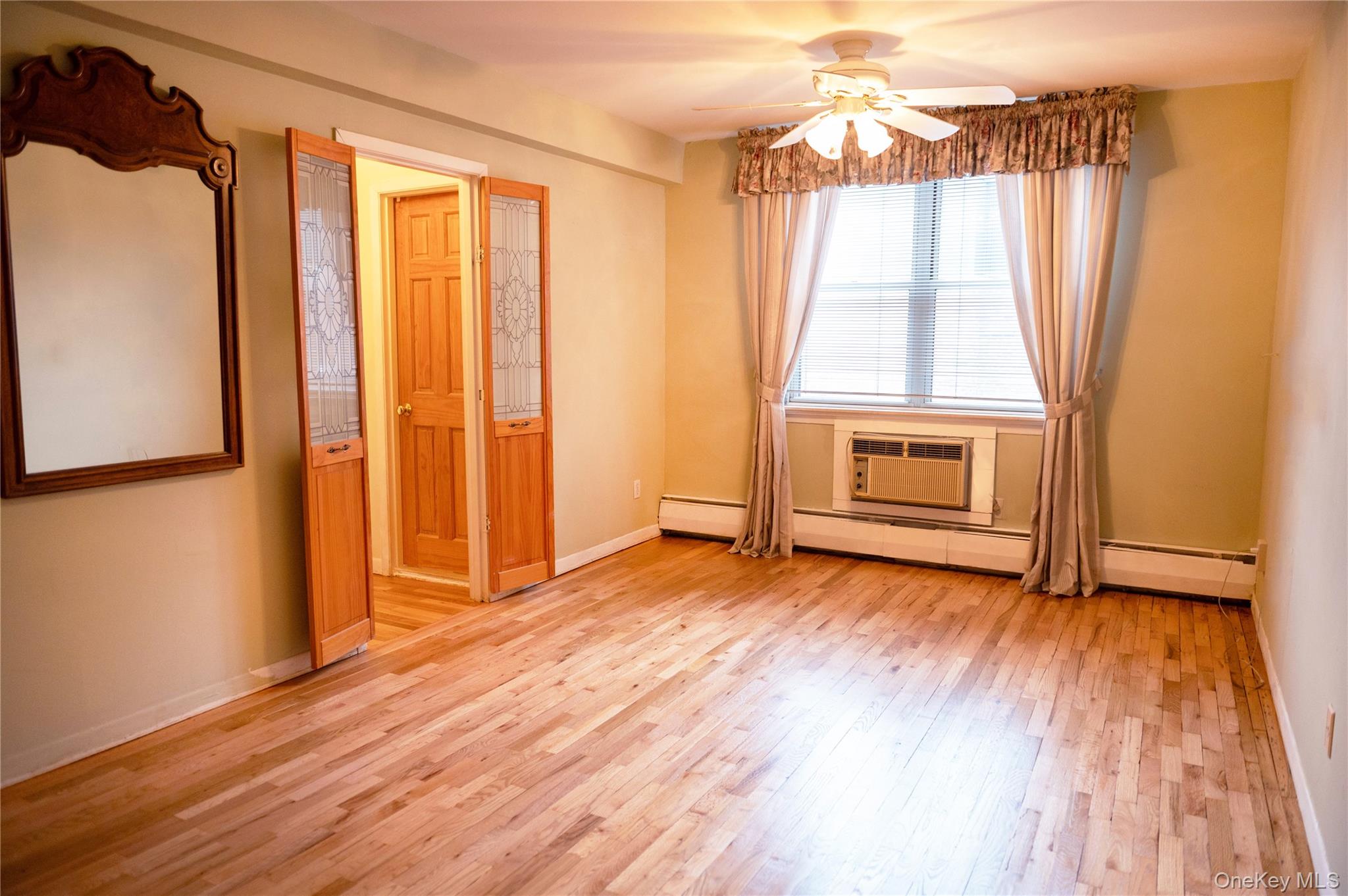 2 Fowler Avenue, Unit 228 Lynbrook, NY 11563 - Photo 13 of 21 Primary Bedroom with newly refinished floors
