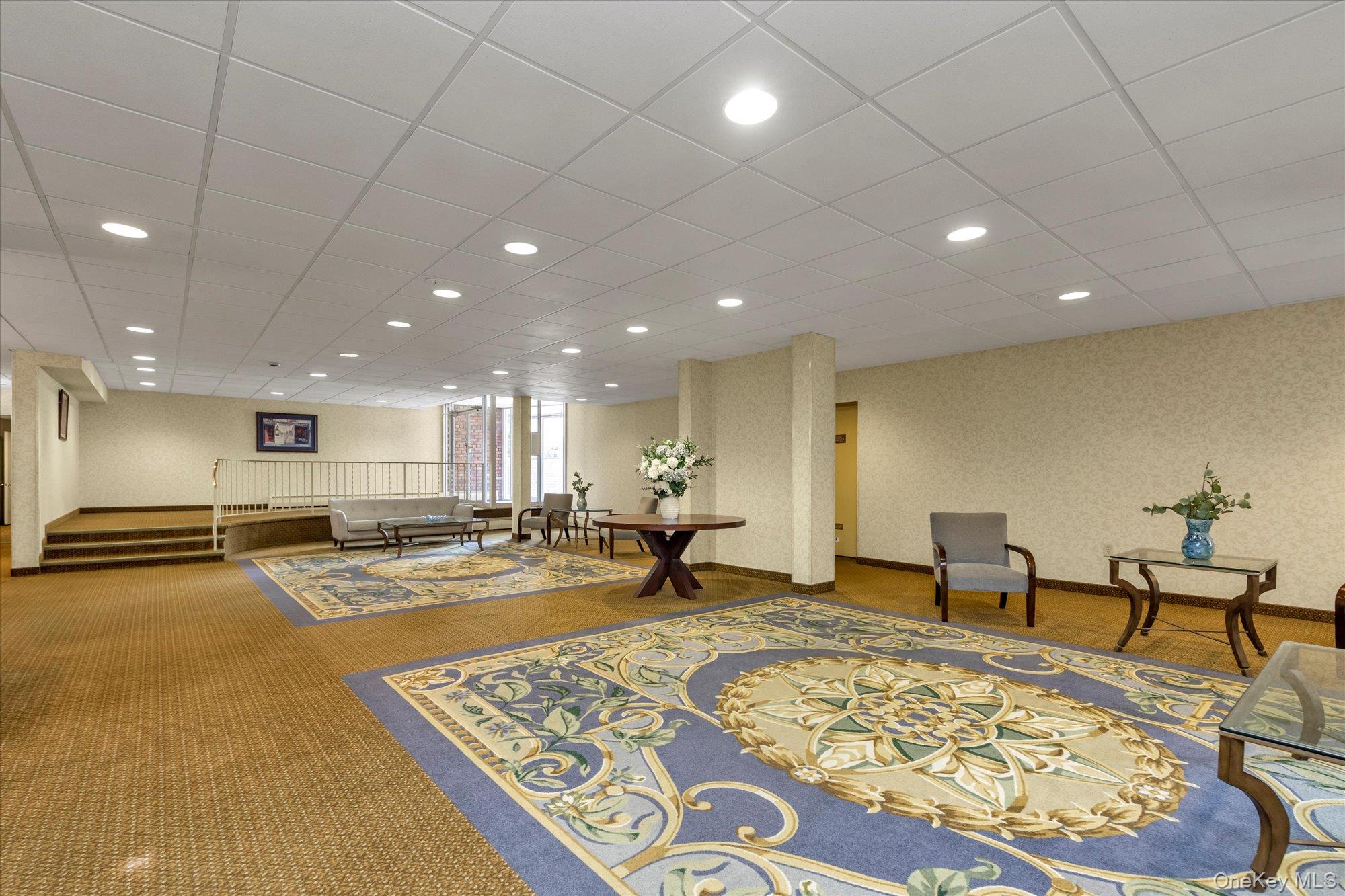 2 Fowler Avenue, Unit 228 Lynbrook, NY 11563 - Photo 15 of 18 a view of a lobby with furniture