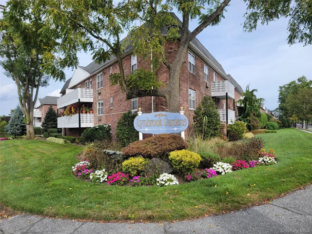 a bunch of flowers in front of the house
