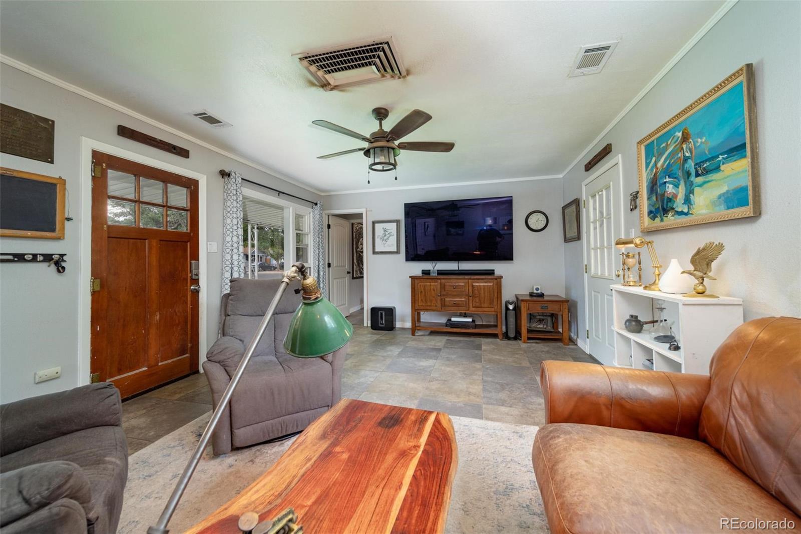 1749 North 15th Street Grand Junction, CO 81501 - Photo 11 of 23 a living room with furniture a flat screen tv and a fireplace