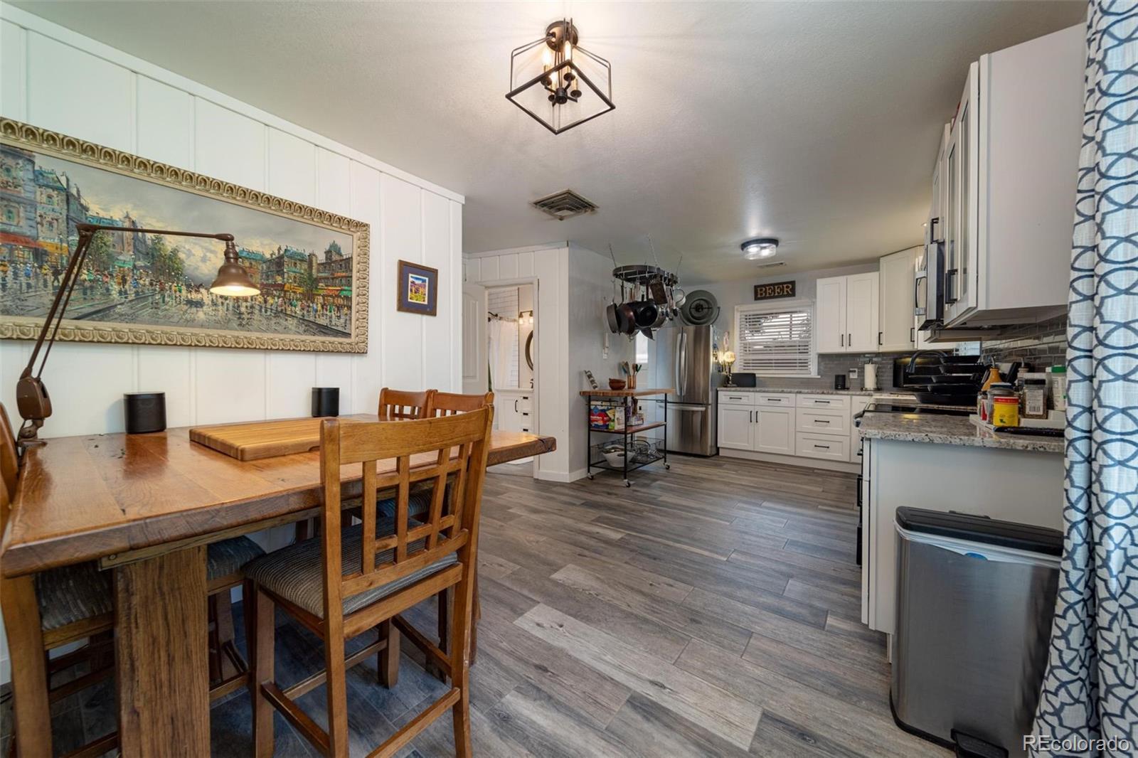 1749 North 15th Street Grand Junction, CO 81501 - Photo 12 of 23 a living room with stainless steel appliances kitchen island granite countertop furniture and a kitchen view