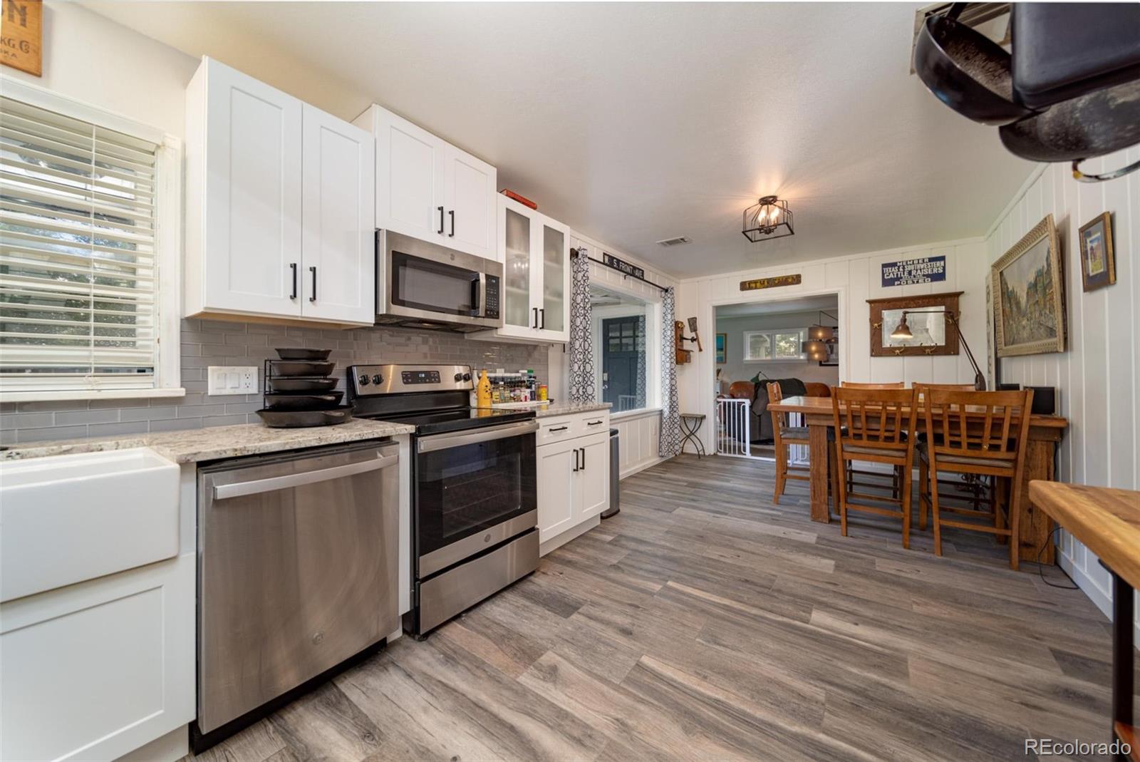 1749 North 15th Street Grand Junction, CO 81501 - Photo 17 of 23 a kitchen with stainless steel appliances granite countertop wooden cabinets a stove top oven a sink and dishwasher