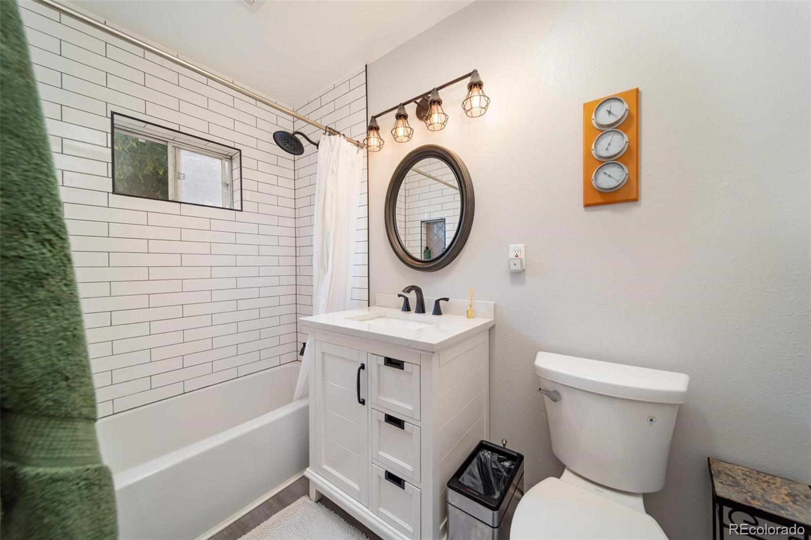 1749 North 15th Street Grand Junction, CO 81501 - Photo 18 of 23 a bathroom with a sink a toilet and a bathtub