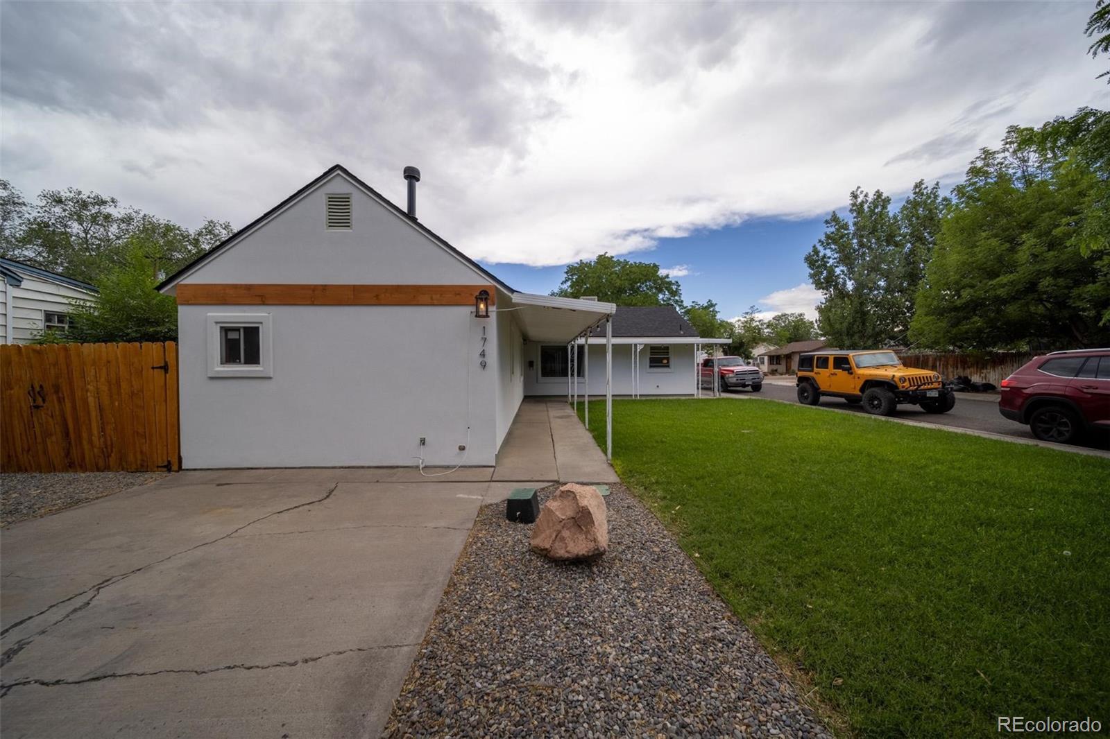 1749 North 15th Street Grand Junction, CO 81501 - Photo 2 of 23 front view of house with a yard