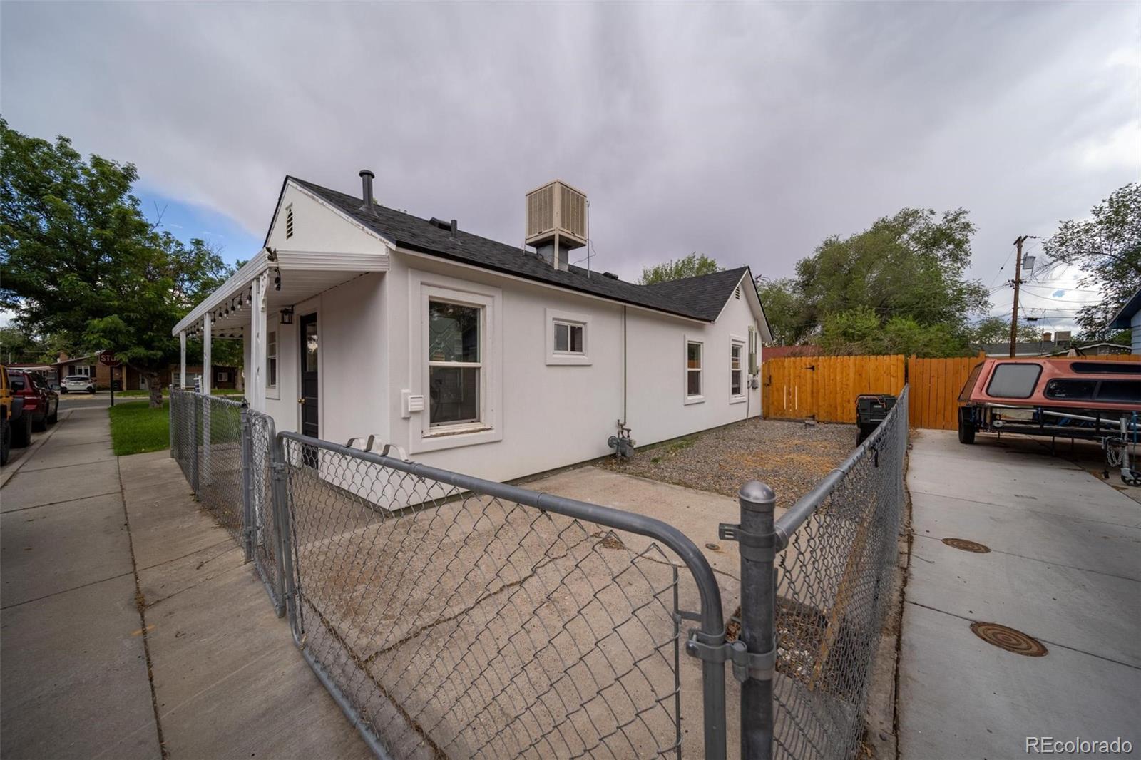1749 North 15th Street Grand Junction, CO 81501 - Photo 23 of 23 a view of a white house with a patio