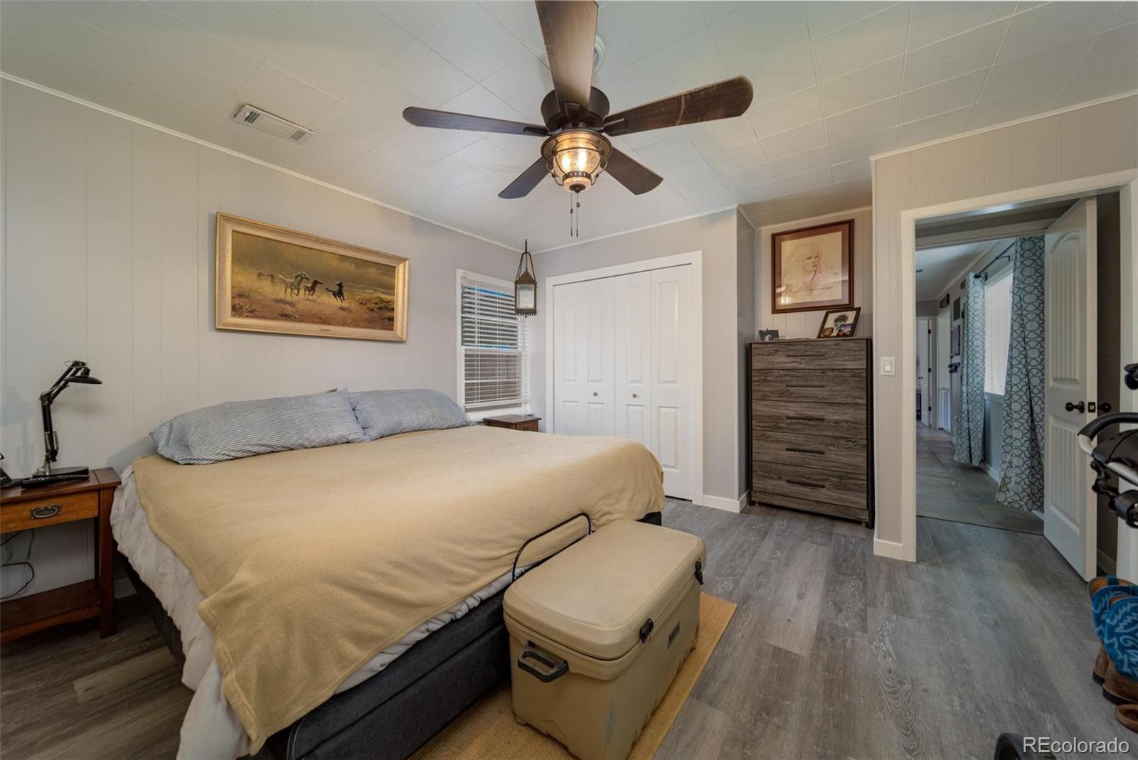 1749 North 15th Street Grand Junction, CO 81501 - Photo 6 of 23 a bedroom with a bed and a chandelier