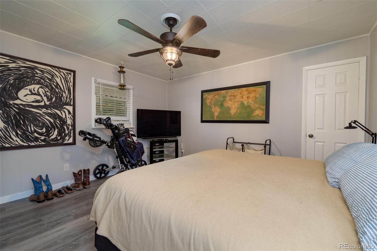 1749 North 15th Street Grand Junction, CO 81501 - Photo 7 of 23 a bedroom with a bed and a flat screen tv