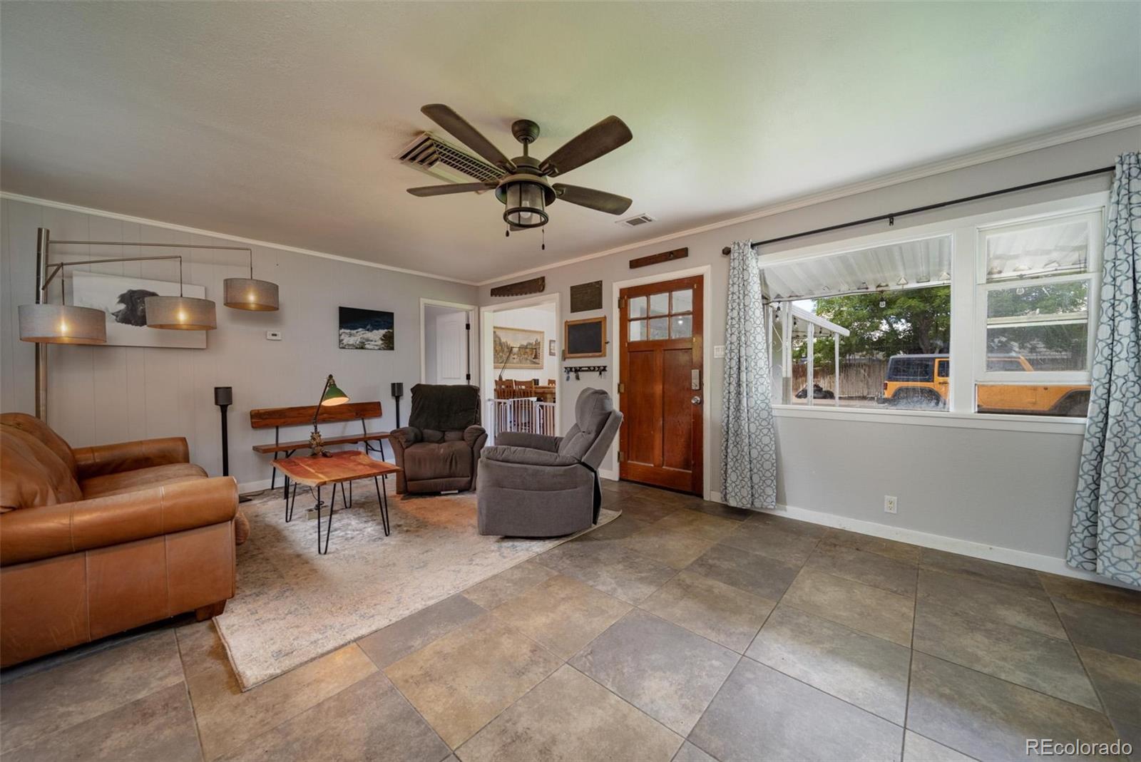 1749 North 15th Street Grand Junction, CO 81501 - Photo 9 of 23 a living room with furniture and a window
