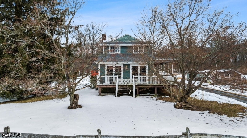 63 Linvale Road Ringoes, NJ 08551 - Photo 38 of 49 a front view of a house with a yard covered in snow
