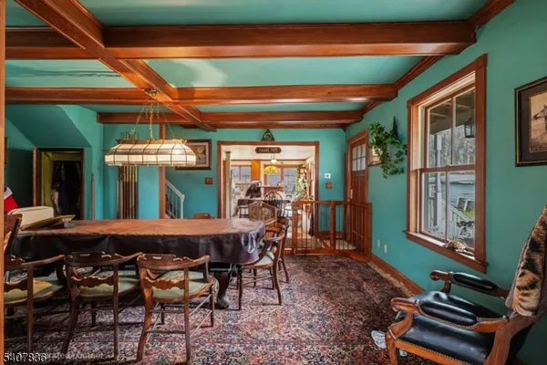 a front view of a house with a yard covered in snow