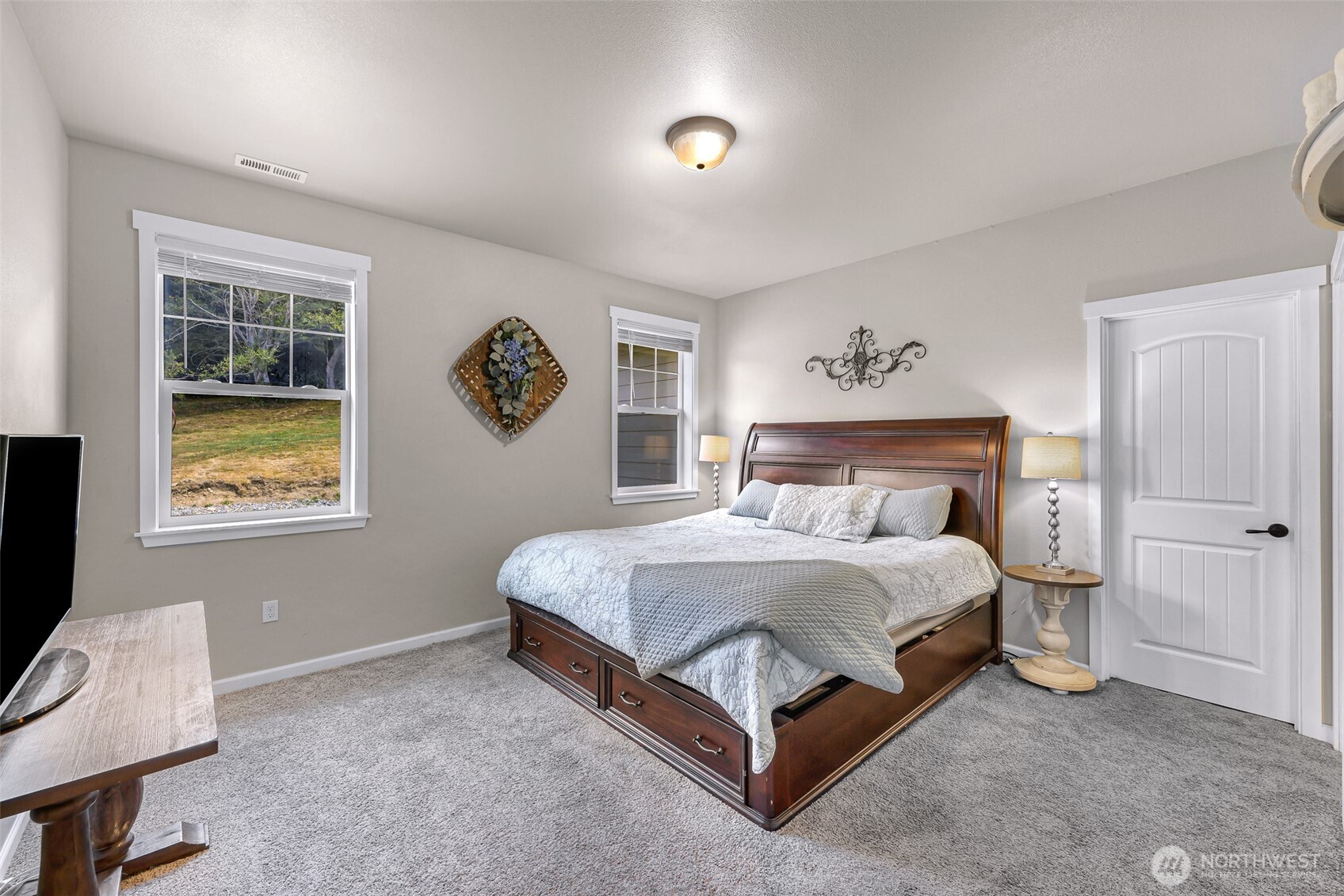 19727 Skyridge Road Mount Vernon, WA 98274 - Photo 14 of 32 a spacious bedroom with a bed and a window