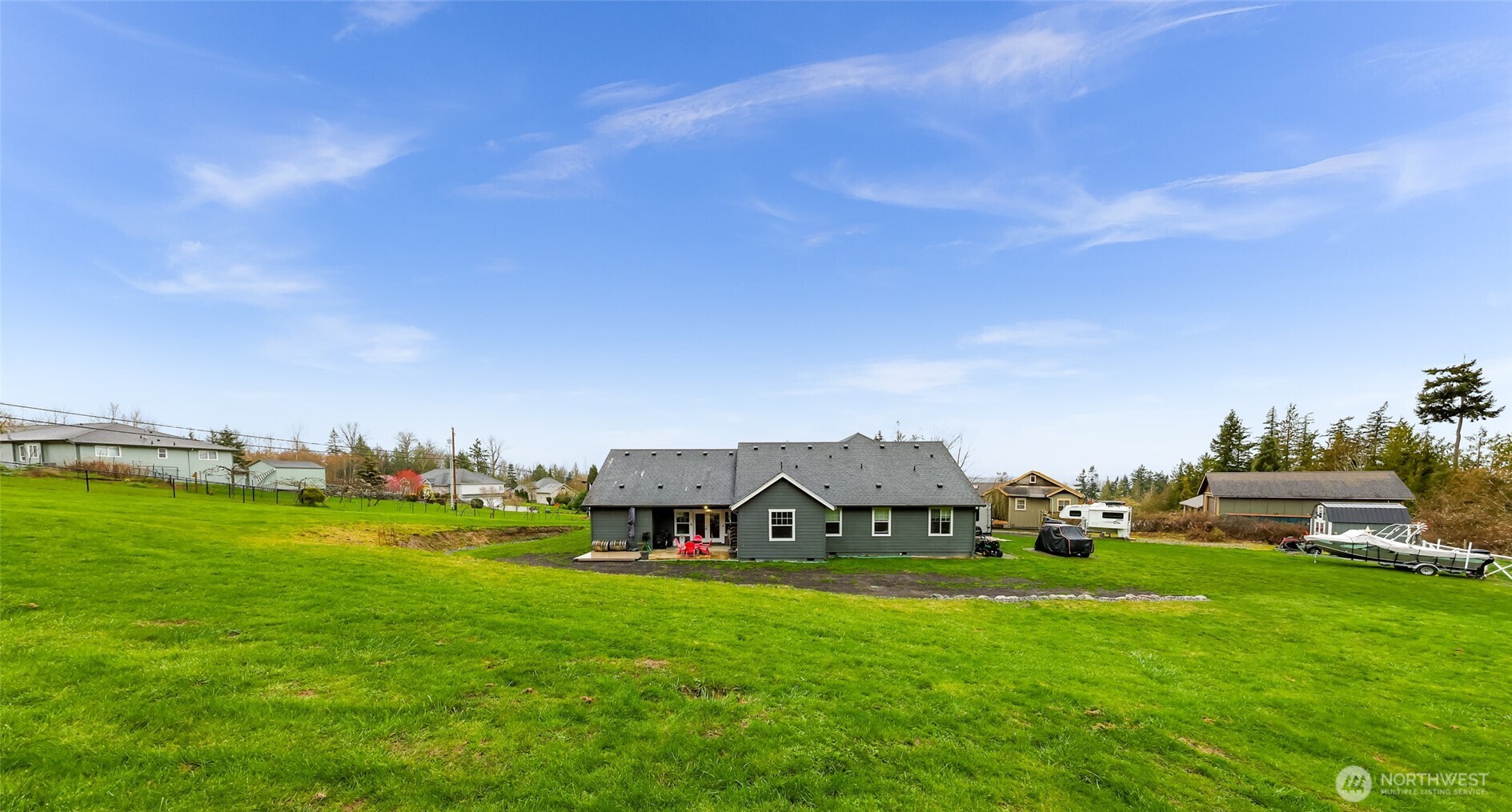 19727 Skyridge Road Mount Vernon, WA 98274 - Photo 25 of 32 a view of a house with a big yard and large trees