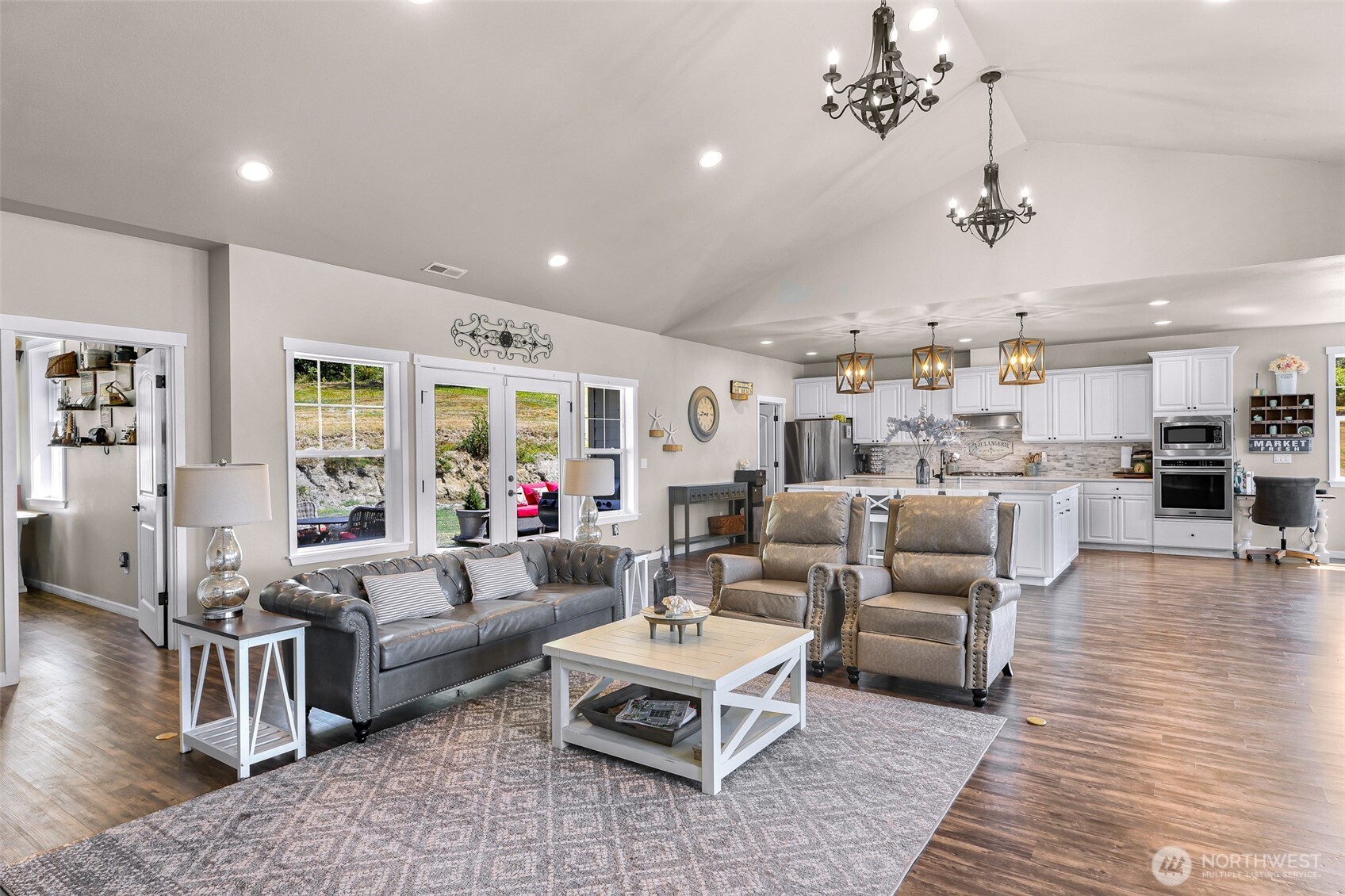 19727 Skyridge Road Mount Vernon, WA 98274 - Photo 9 of 32 a living room with furniture kitchen view and a table