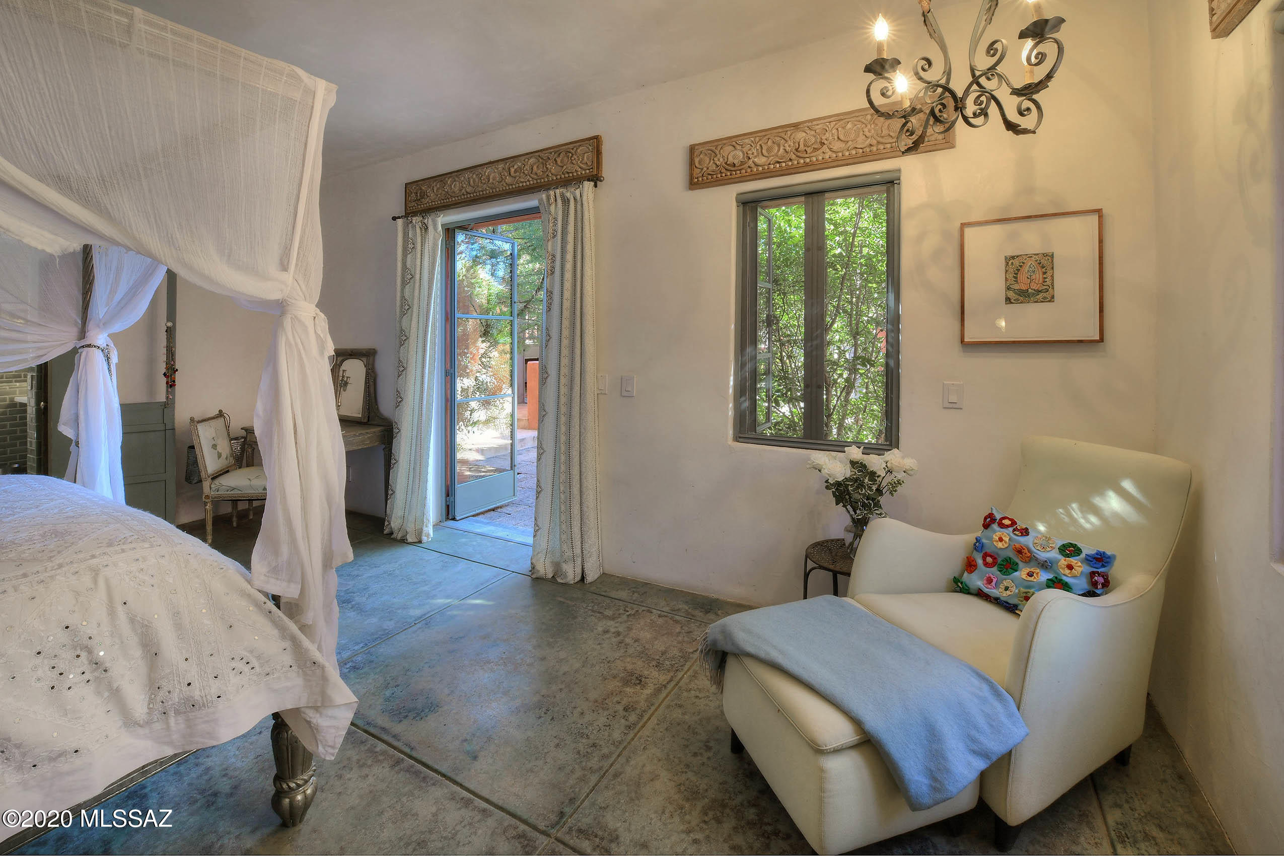 360 Harshaw Creek Road Patagonia, AZ 85624 - Photo 27 of 50 a bed room with a bed and a window