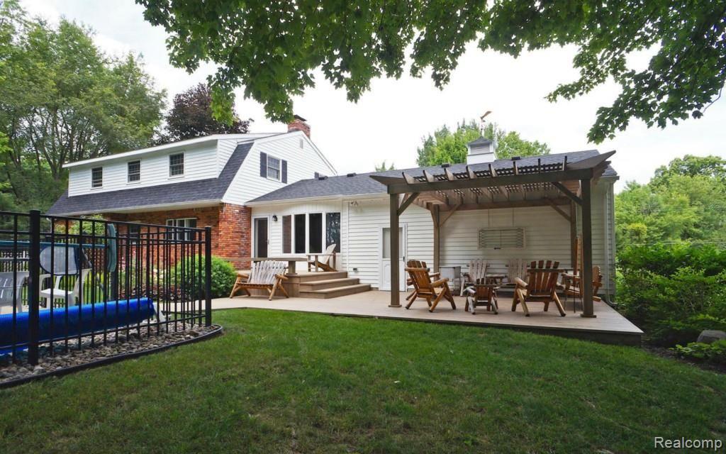 6174 Hardy Lane Howell, MI 48855 - Photo 21 of 25 Two tiered deck off of the back of the home that leads to the pool.